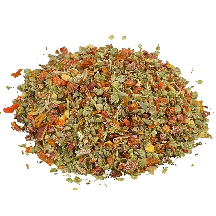 Ein kleiner Haufen Hot Bandito Dip Bio Gemüse- und Gewürzzubereitung. Die Bio Gemüse- und Gewürzzubereitung hat eine grüne und orange Farbe. Die Zutaten sind gut zu erkennen. Es sieht sehr lecker aus.