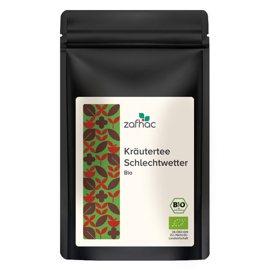 Schwarze Verpackung mit Aufschrift „Kräutertee Schlechtwetter Bio“